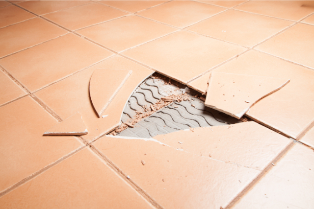 Broken tiles in a home floor