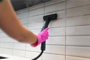 Cleaning tiles with steam machine