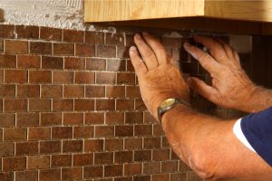 Worker Installing a Backsplash